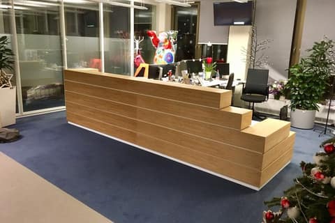 Timber reception counter in a completed office