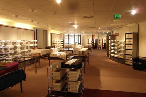 Completed retail floor with shelving and ceiling lighting